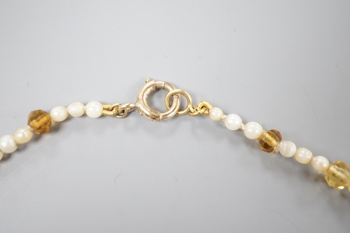 A single strand oval cut citrine and seed pearl set fringe necklace, with 9ct clasp, 44cm